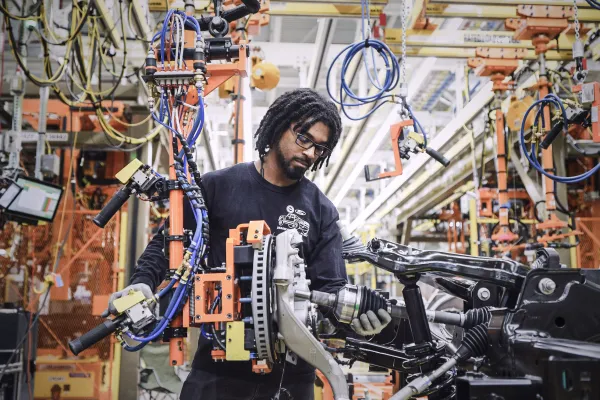 A worker inside an electric vehicle factory